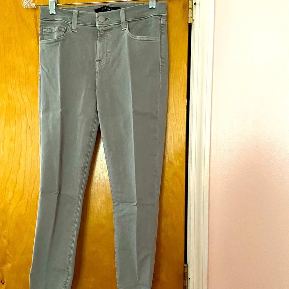 JBrand skinny jeans in gray green color with distressed detail at hem